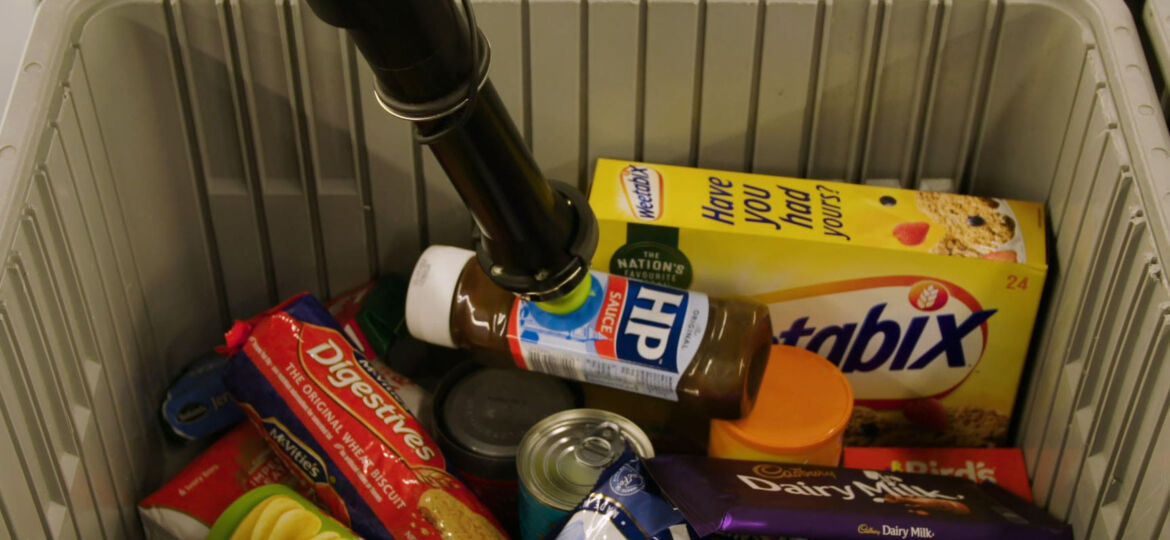 Berkshire Grey Robotic Pick Cell "Boxy" picks UK grocery goods from a tote for fulfill a BOPIS product order