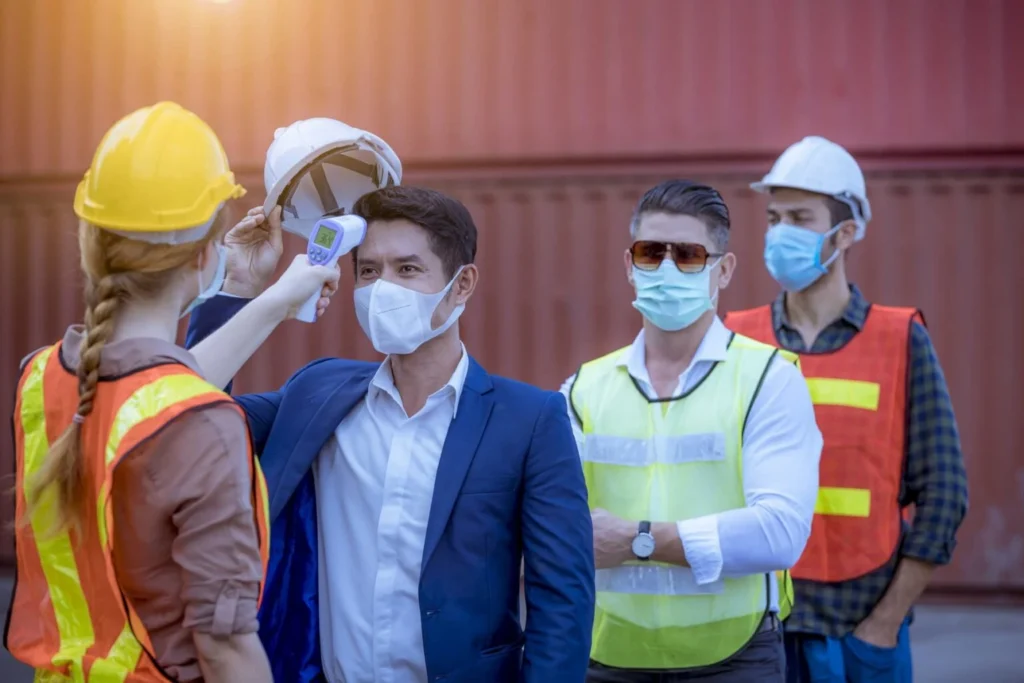 Warehouse workers complete a health check upon arrival to their shift.