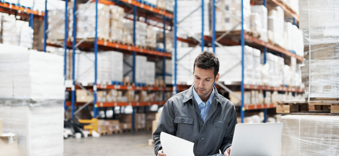 warehouse worker with paper not digital