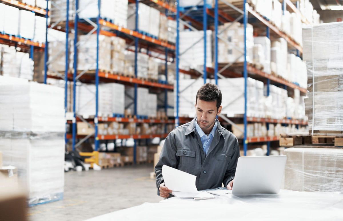 warehouse worker with paper not digital