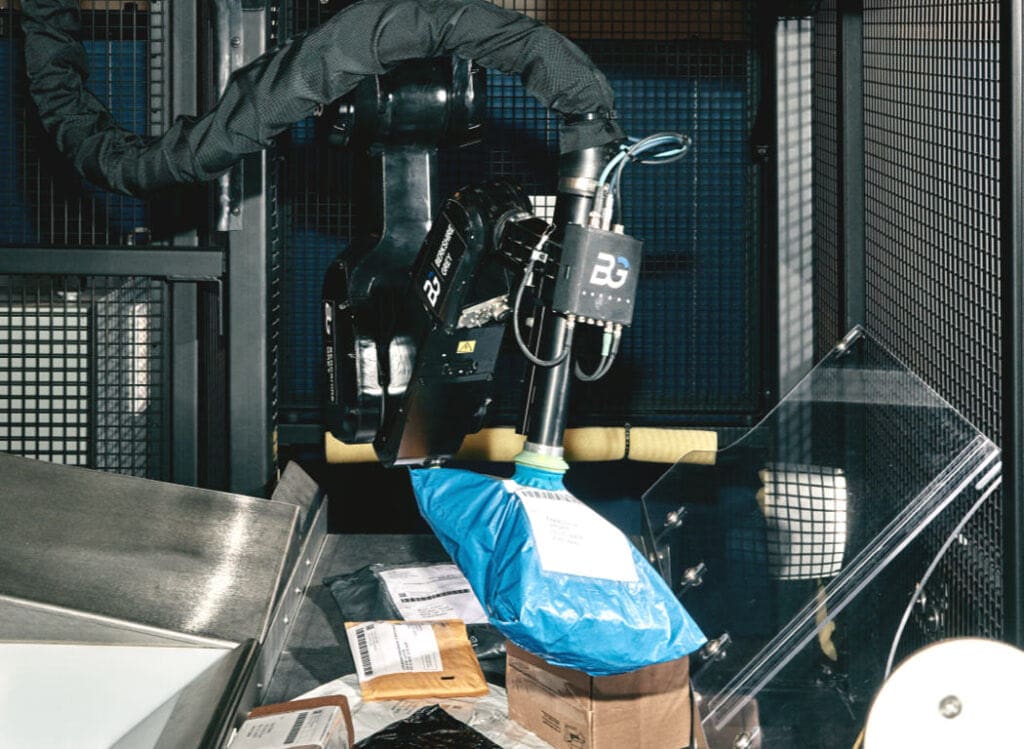 A robotic arm sorting packages.