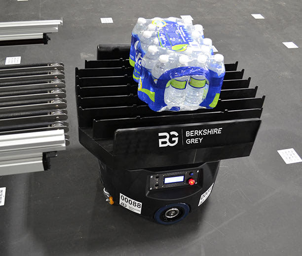 A Berkshire Grey FLEXbot transports a SKU for aisle-ready sequencing.