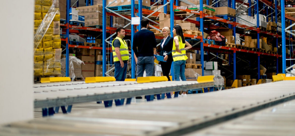 Warehouse workers meet with their managers