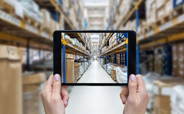 Looking through a mobile device camera at a warehouse with no workers
