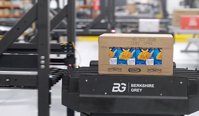 a case of grocery product is sequenced on the low-density storage by mobile robots.