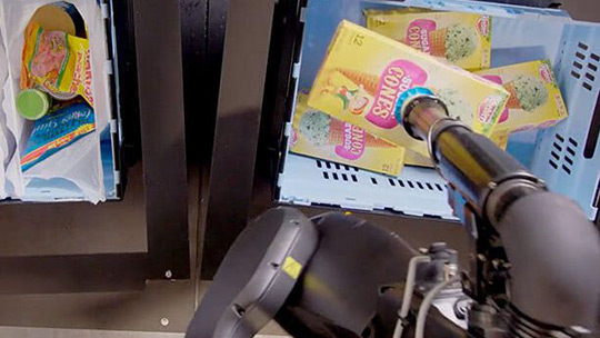 A Berkshire Grey pick and pack station fulfills the most demanding of orders... ice cream cones from an inventory tote into bags by rotating the long dimension box to place through a narrow opening.