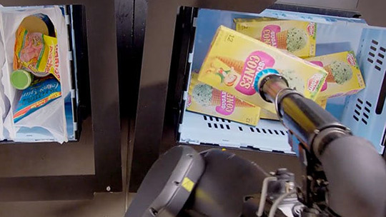 A Berkshire Grey pick and pack station fulfills the most demanding of orders... ice cream cones from an inventory tote into bags by rotating the long dimension box to place through a narrow opening.