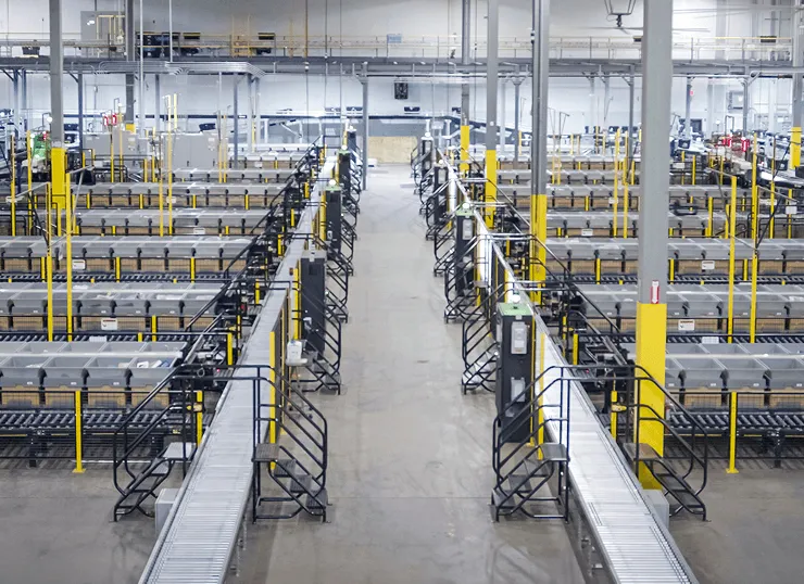 Wide elevated view of an automated warehouse sorting facility.