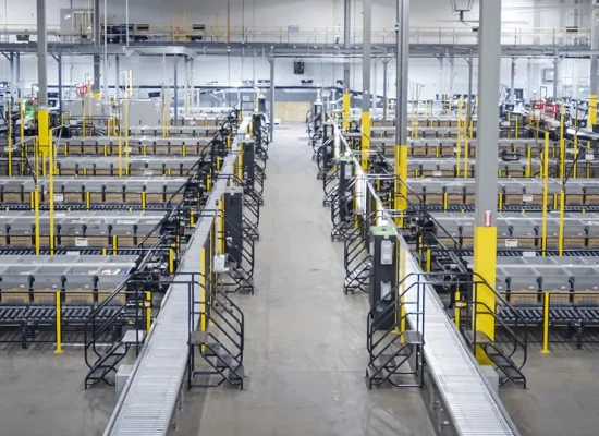 Wide elevated view of an automated warehouse sorting facility.